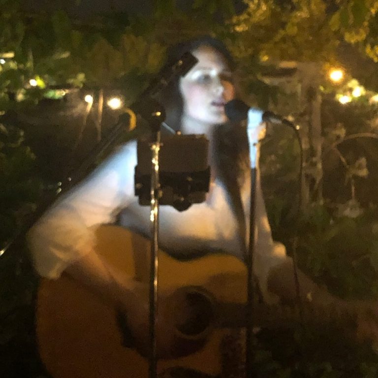 Emma Coleman performing in the Remedies Parlor Garden