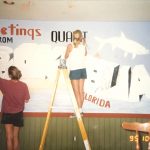 Martha and her helper paint a restaurant mural