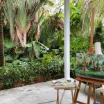 Martha's easel is set up in Marti Koehler's beautiful tropical backyard.