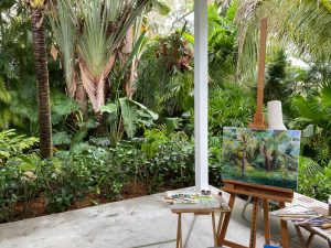 Martha's easel is set up in Marti Koehler's beautiful tropical backyard.