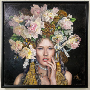 painting entitled queen bee of a womans face with a crown of flowers and honeycombs. there are bees flying around her crown. by martha dodd