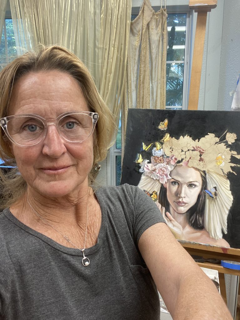 Martha painting the butterfly queen in her studio