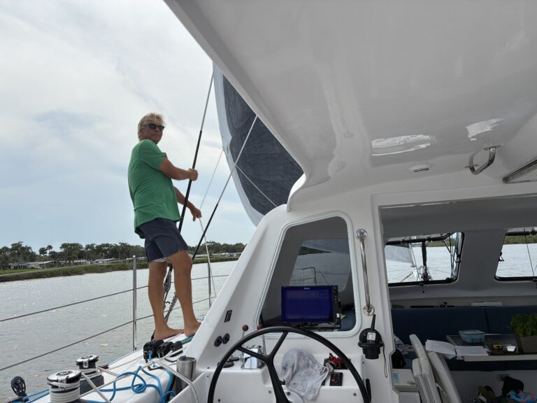 Marc standing on the port side of a catamaran